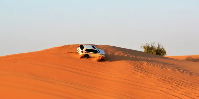 4x4 on red desert dunes